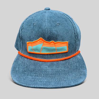 Raree Finds blue corduroy snapback hat with orange rope detail and mountain landscape embroidered patch logo