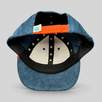 Raree Finds Sendero Provisions Co blue corduroy snapback hat with orange adjustable strap and interior leaf pattern