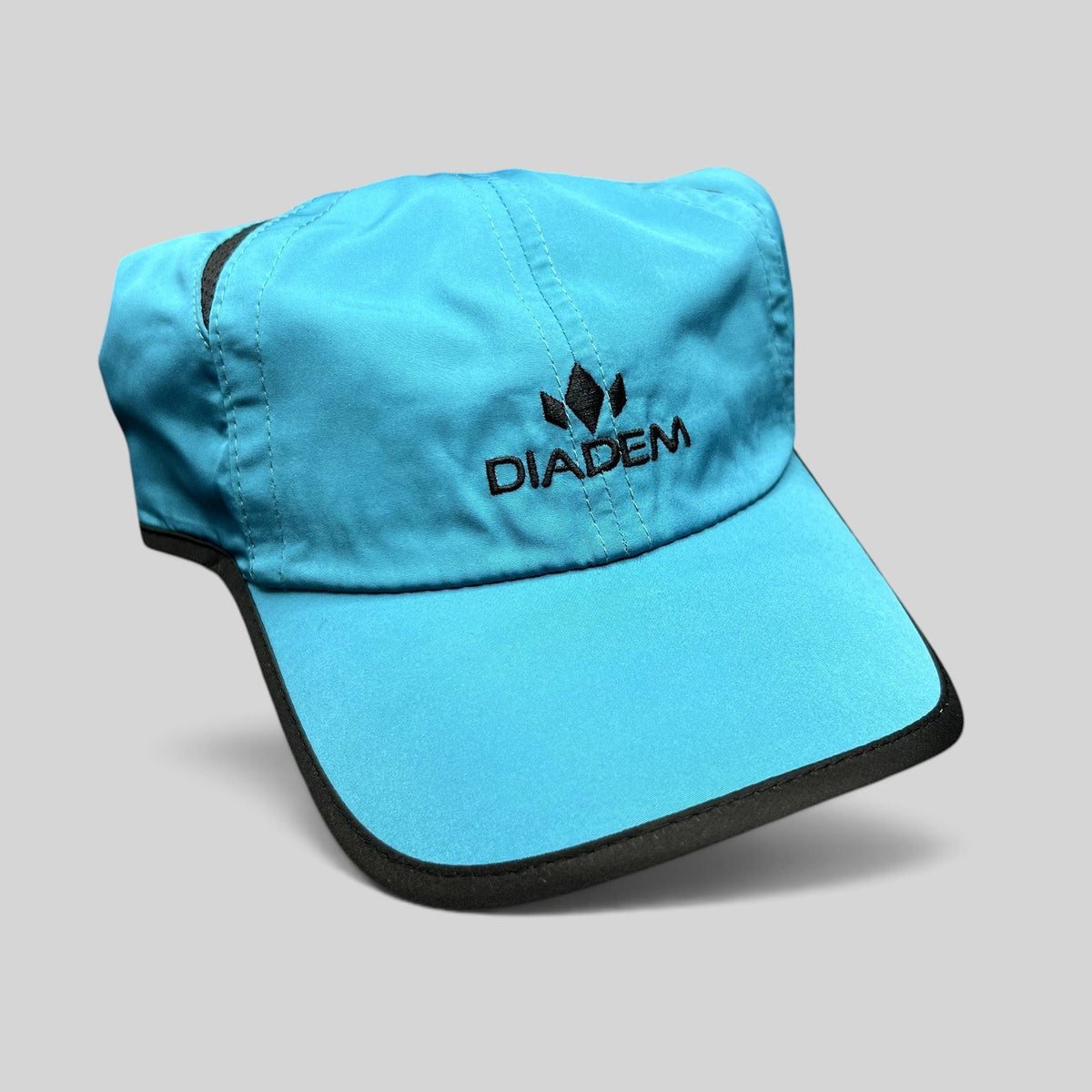 Raree Finds blue lightweight Diadem performance running hat with black trim and embroidered logo