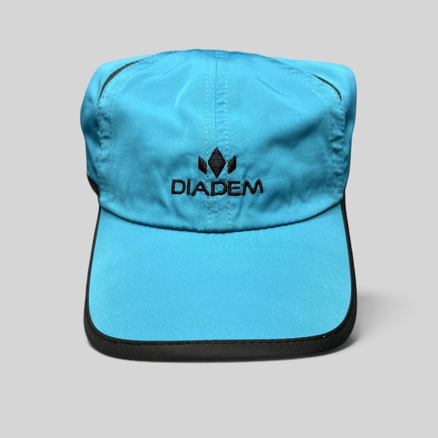 Raree Finds blue Diadem performance running hat with black trim and embroidered logo on lightweight polyester fabric