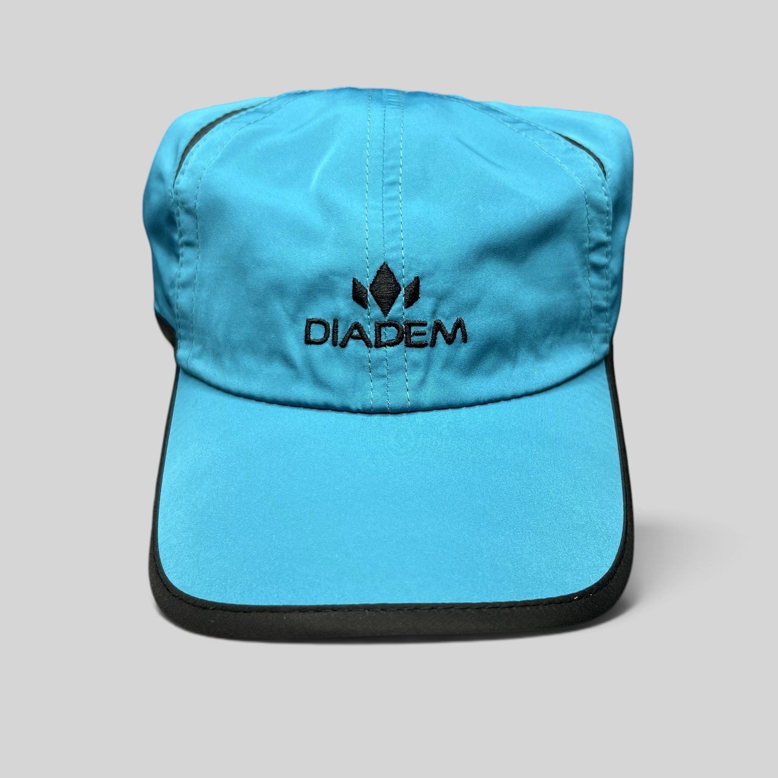 Raree Finds blue Diadem performance running hat with black trim and embroidered logo on lightweight polyester fabric