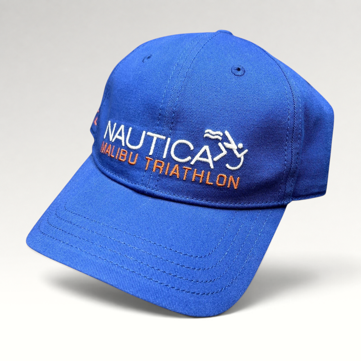 Raree Finds blue cotton Nautica Malibu Triathlon strapback hat with embroidered front logo and pre-curved brim.