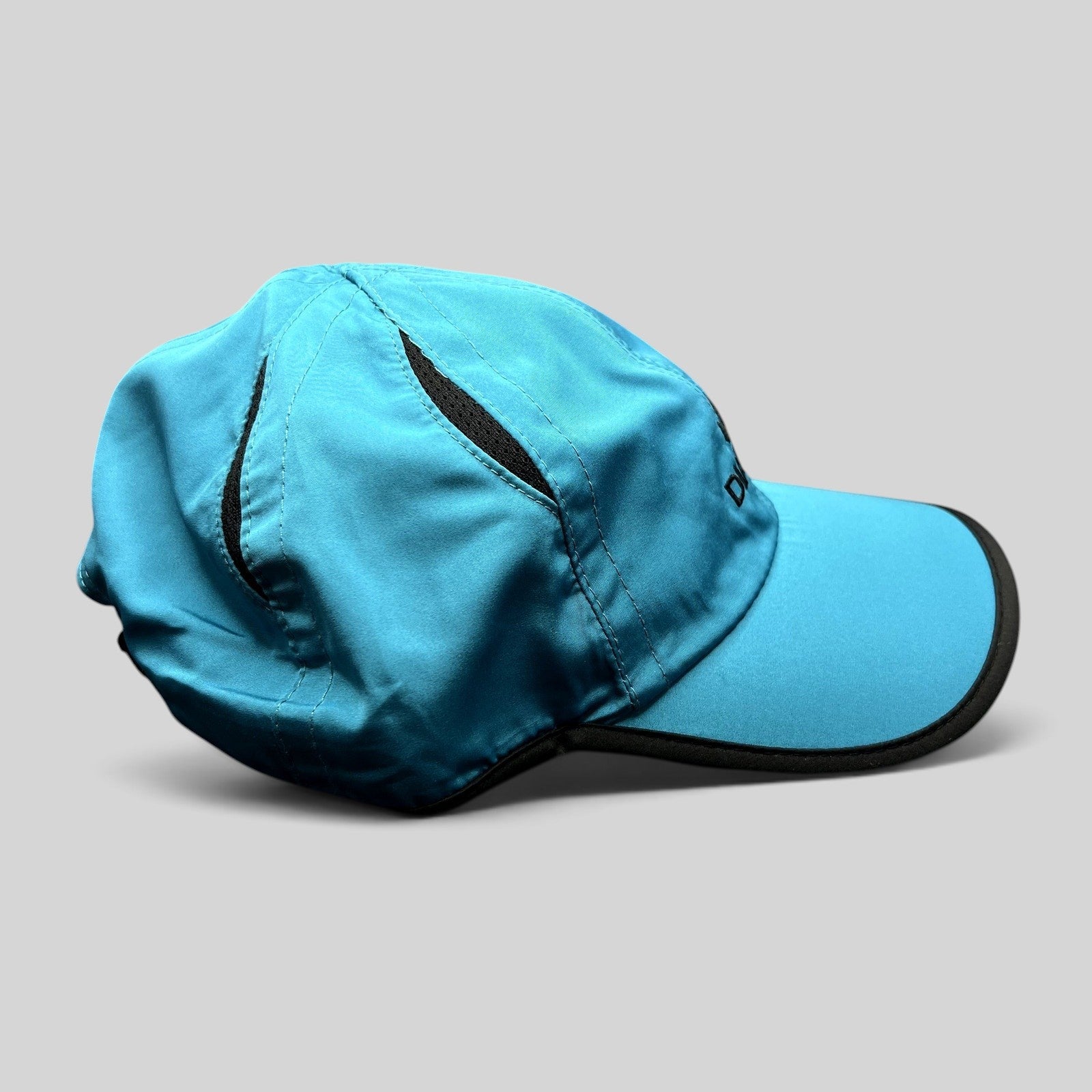 Raree Finds blue lightweight performance running hat with black trim and embroidered Diadem logo on the side profile