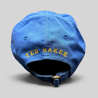 Raree Finds royal blue cotton Ted Baker strapback cap with yellow embroidered rear logo and antique brass buckle