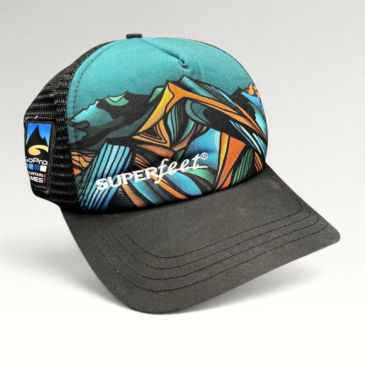 Raree Finds Boco Gear Superfeet trucker hat with colorful mountain graphic, black mesh back, and snapback closure.