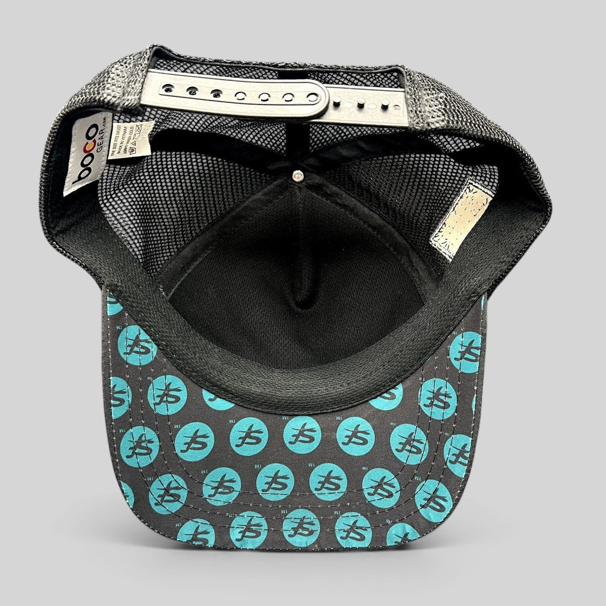 Raree Finds Boco Gear trucker hat showing the underside of the brim with teal Superfeet logo print and black mesh