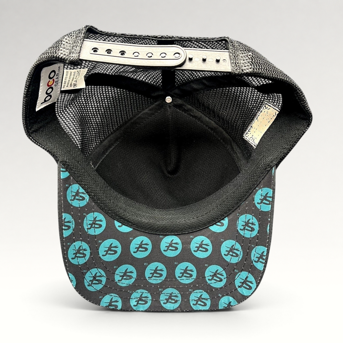 Raree Finds Boco Gear trucker hat showing the underside of the brim with teal Superfeet logo print and black mesh