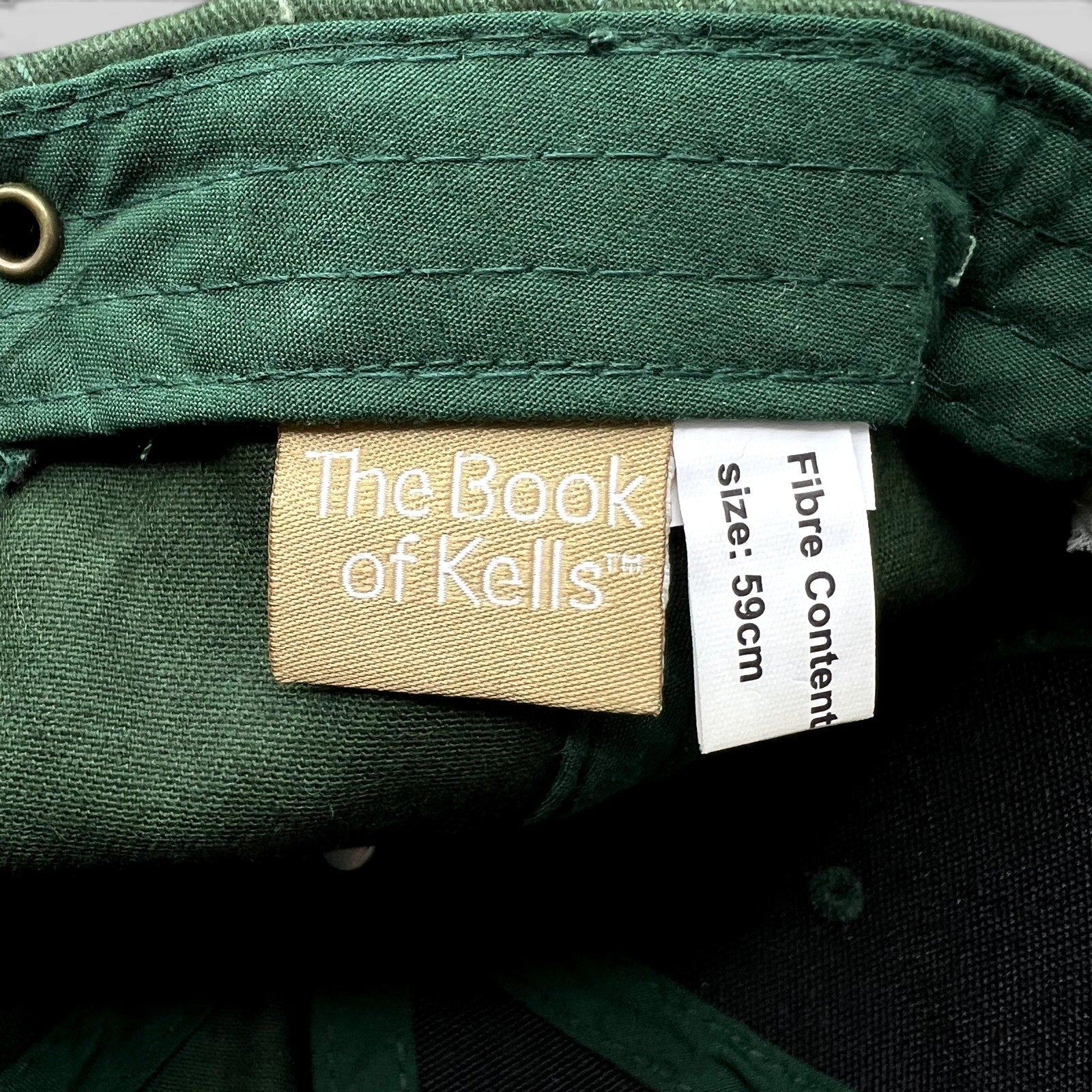 Raree Finds The Book of Kells dark green hat interior label showing size 59cm and official branding