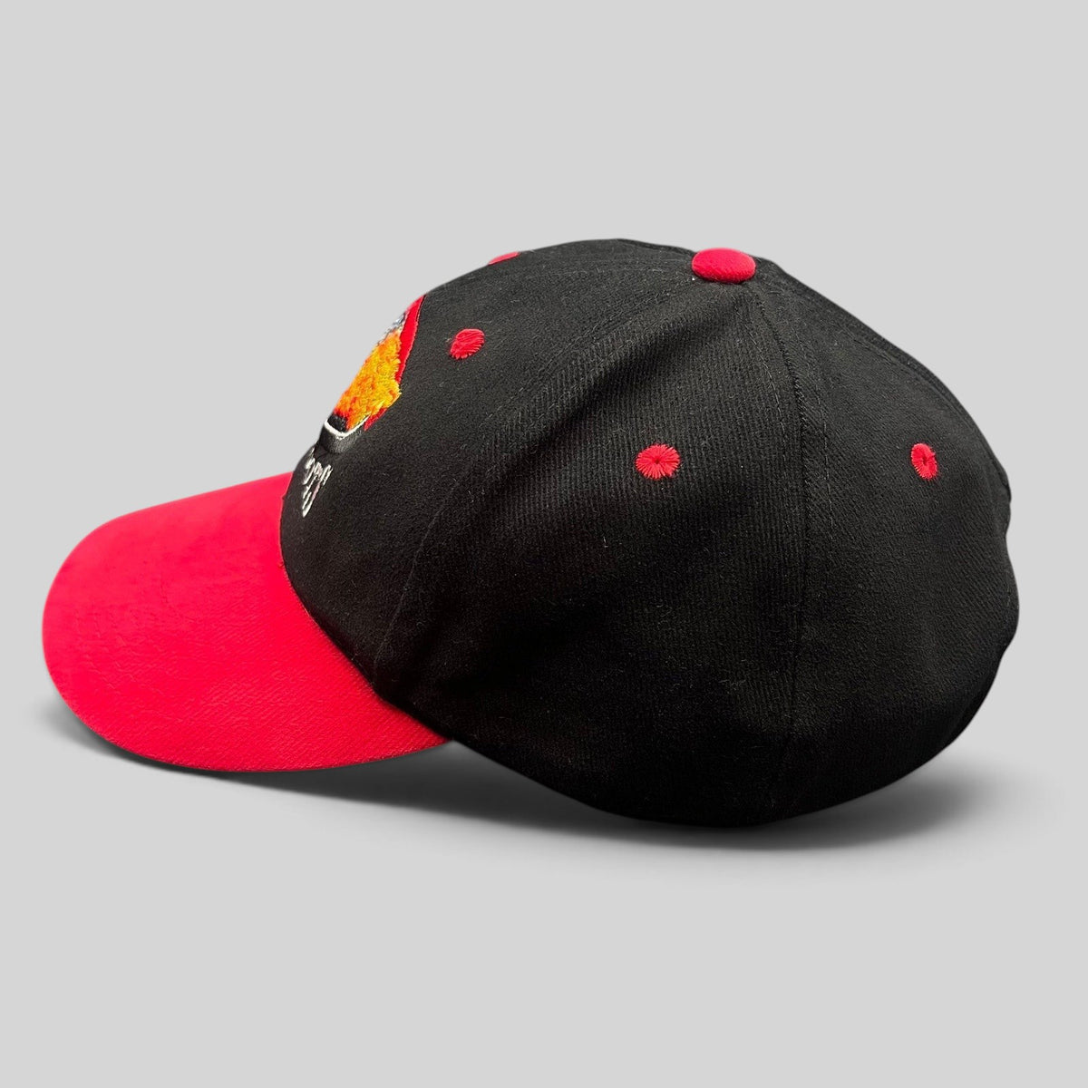 Raree Finds vintage Boots & Coots oilfield firefighter snapback hat with a black crown, red brim, and flame logo.