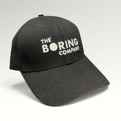 Raree Finds black The Boring Company strapback hat with white embroidered logo on a structured cotton crown