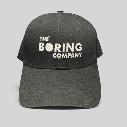 Raree Finds black The Boring Company strapback hat with white embroidered logo on the front