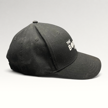 Raree Finds black The Boring Company strapback hat with white embroidered logo on a structured cotton crown
