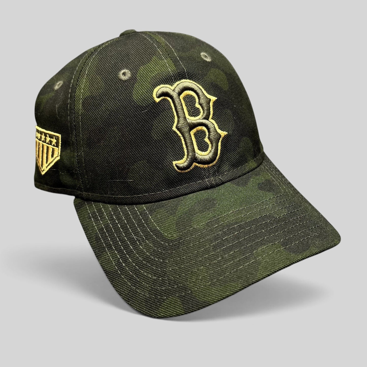 Raree Finds Boston Red Sox New Era 9TWENTY camo strapback hat with black and gold embroidered B logo and side patch.