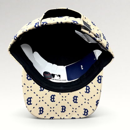 Raree Finds MLB Korea Boston Red Sox strapback hat in beige with blue monogram pattern and adjustable metal closure.