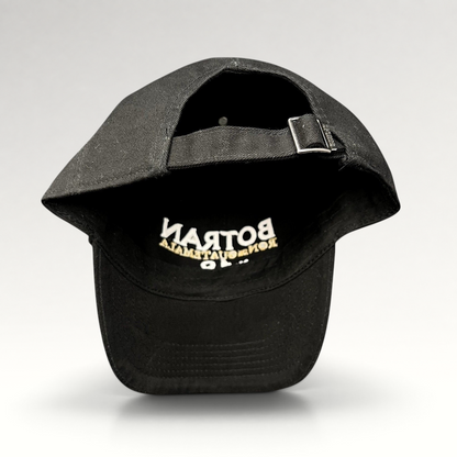 Raree Finds black cotton strapback hat with Botran Ron de Guatemala No. 18 embroidery on the interior brim