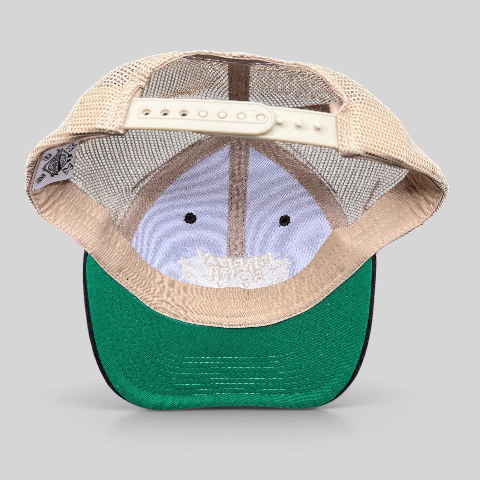 Raree Finds Breezy Bowl XX Chris Brown trucker hat showing the interior green underbill and adjustable snapback strap