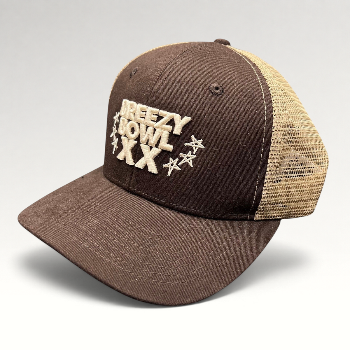 Raree Finds brown and tan Breezy Bowl XX trucker hat with embroidered lettering and mesh back panels.