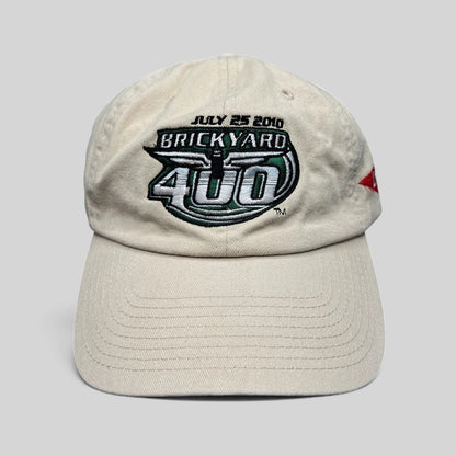 Raree Finds cream cotton 2010 Brickyard 400 NASCAR strapback hat with embroidered event logo and date