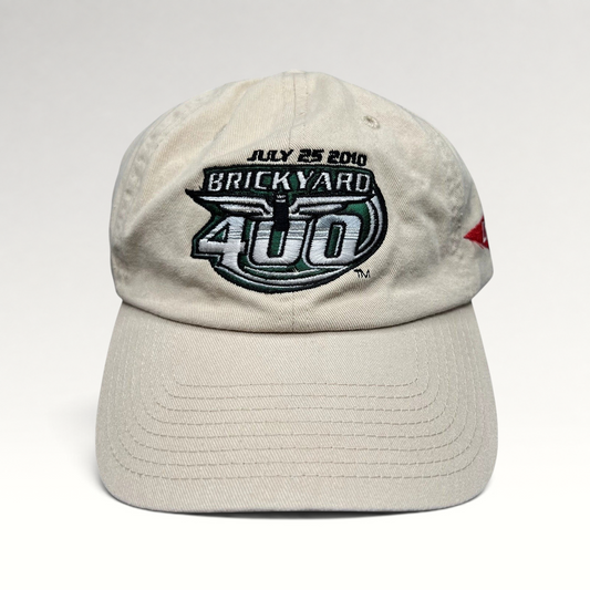 Raree Finds cream cotton 2010 Brickyard 400 NASCAR strapback hat with embroidered event logo and date