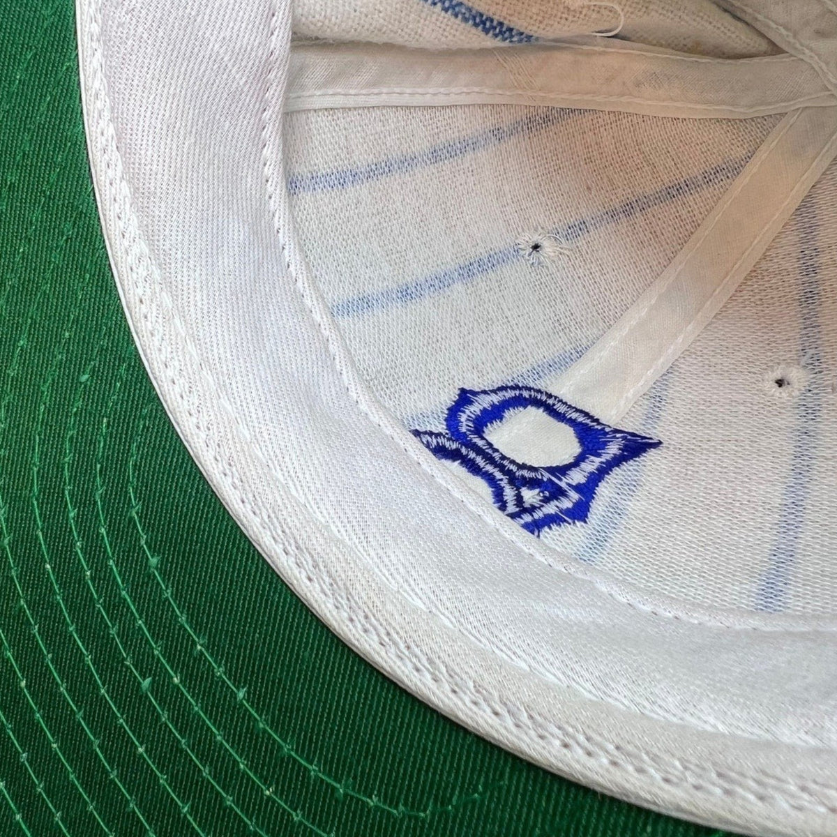 Raree Finds vintage Brooklyn Dodgers pinstripe wool cap interior showing green underbrim and embroidered logo detail