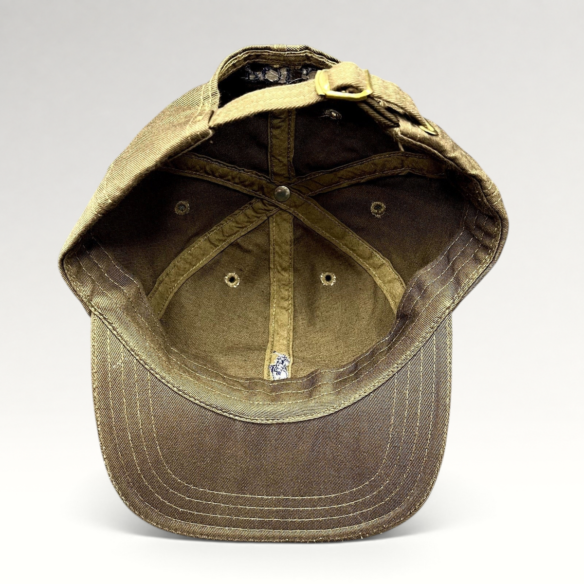 Raree Finds brown cotton Polo Ralph Lauren strapback cap showing the interior lining and brass hardware closure