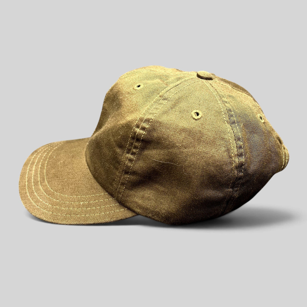 Raree Finds brown cotton strapback cap with a relaxed, low-profile fit and classic baseball hat construction.