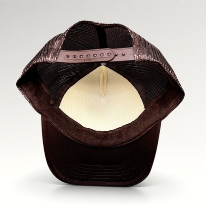 Raree Finds brown and cream trucker snapback hat showing the interior mesh lining and adjustable plastic snap closure.