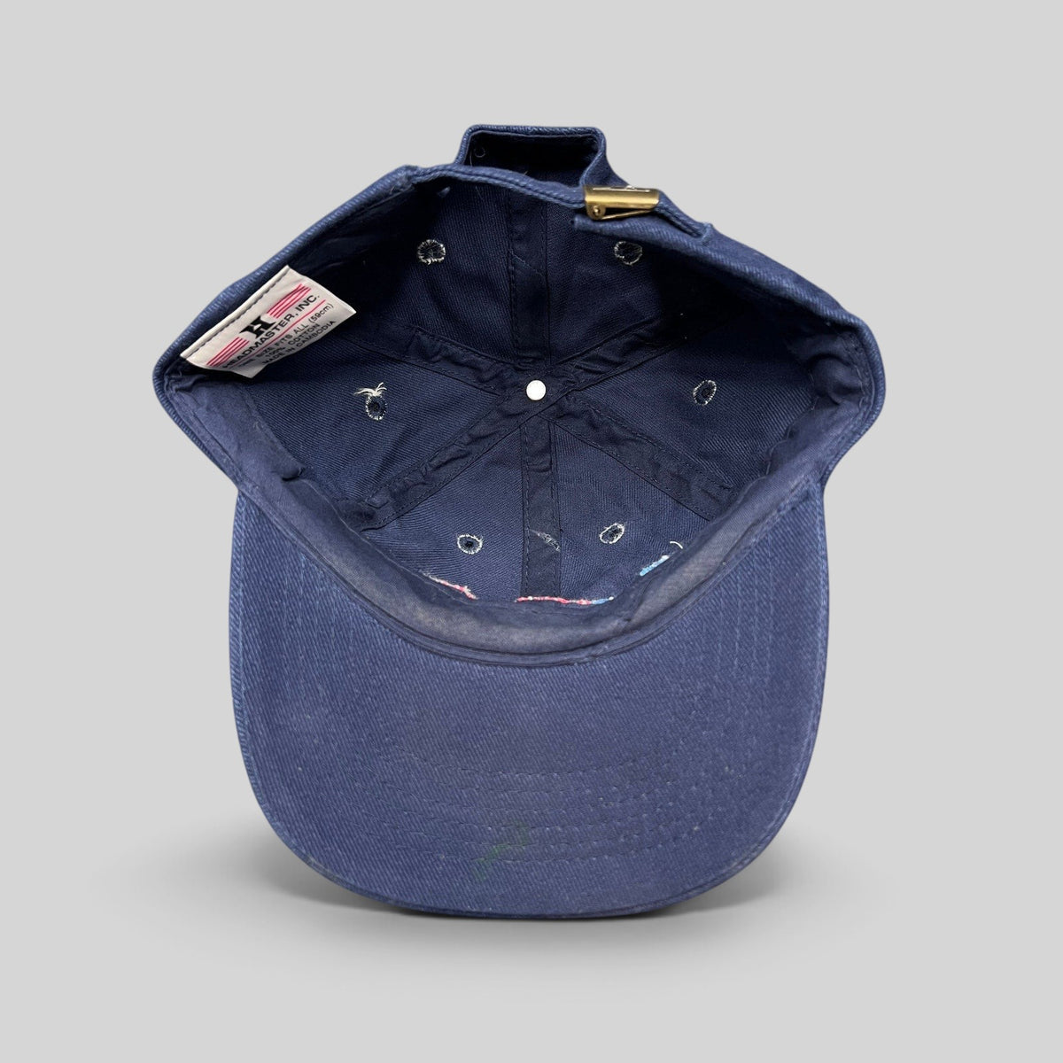 Raree Finds vintage 2003 Bruce Almighty navy blue cotton dad cap interior view showing Headmaster Inc label