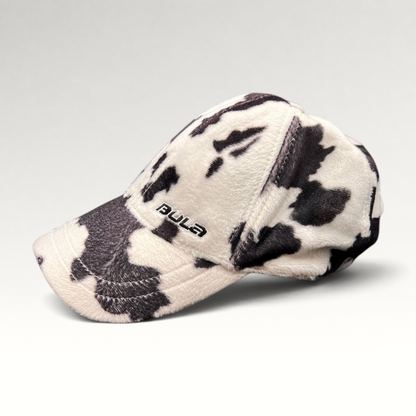 Raree Finds BULA black and white cow print plush fleece baseball cap with curved brim and side logo embroidery