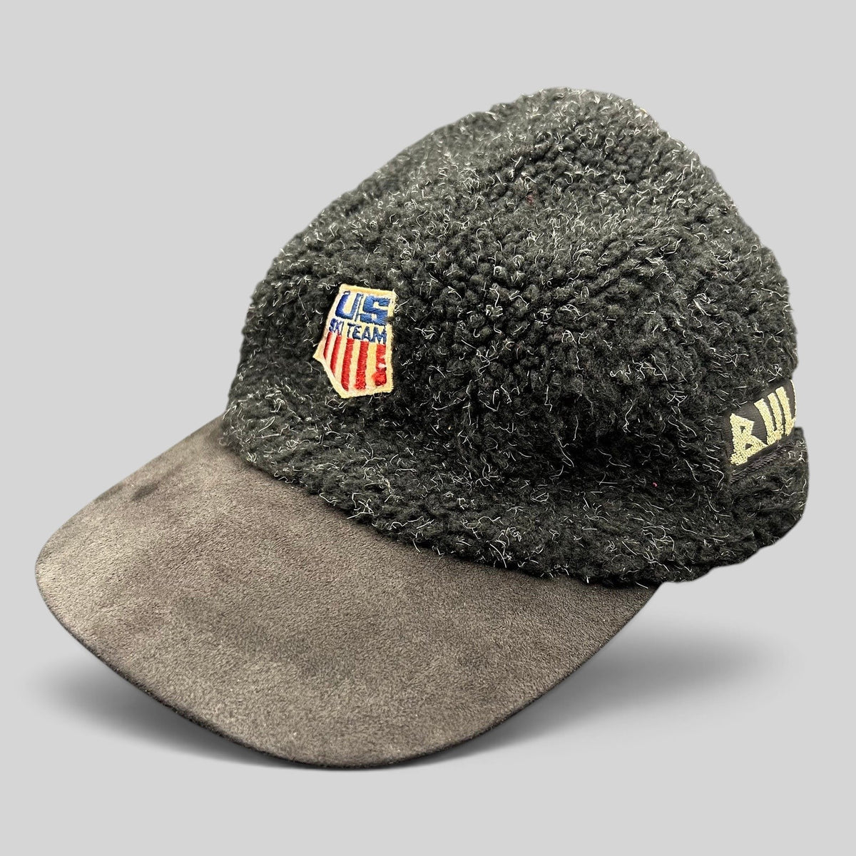 Raree Finds vintage BULA USA Ski Team strapback hat in black sherpa fleece with a suede brim and embroidered patch.