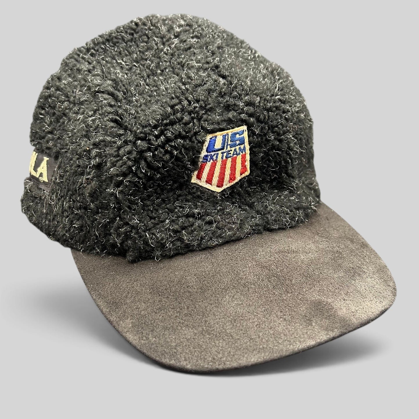 Raree Finds vintage BULA USA Ski Team strapback hat in black sherpa fleece with a suede brim and embroidered patch.
