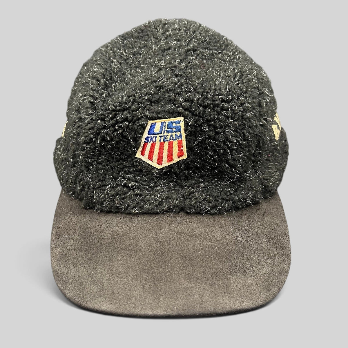 Raree Finds vintage BULA USA Ski Team strapback hat in black sherpa fleece with a suede brim and embroidered patch.