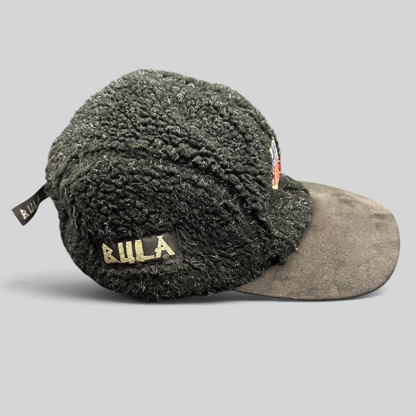 Raree Finds vintage BULA USA Ski Team strapback hat in black sherpa fleece with a suede brim and side logo patch.