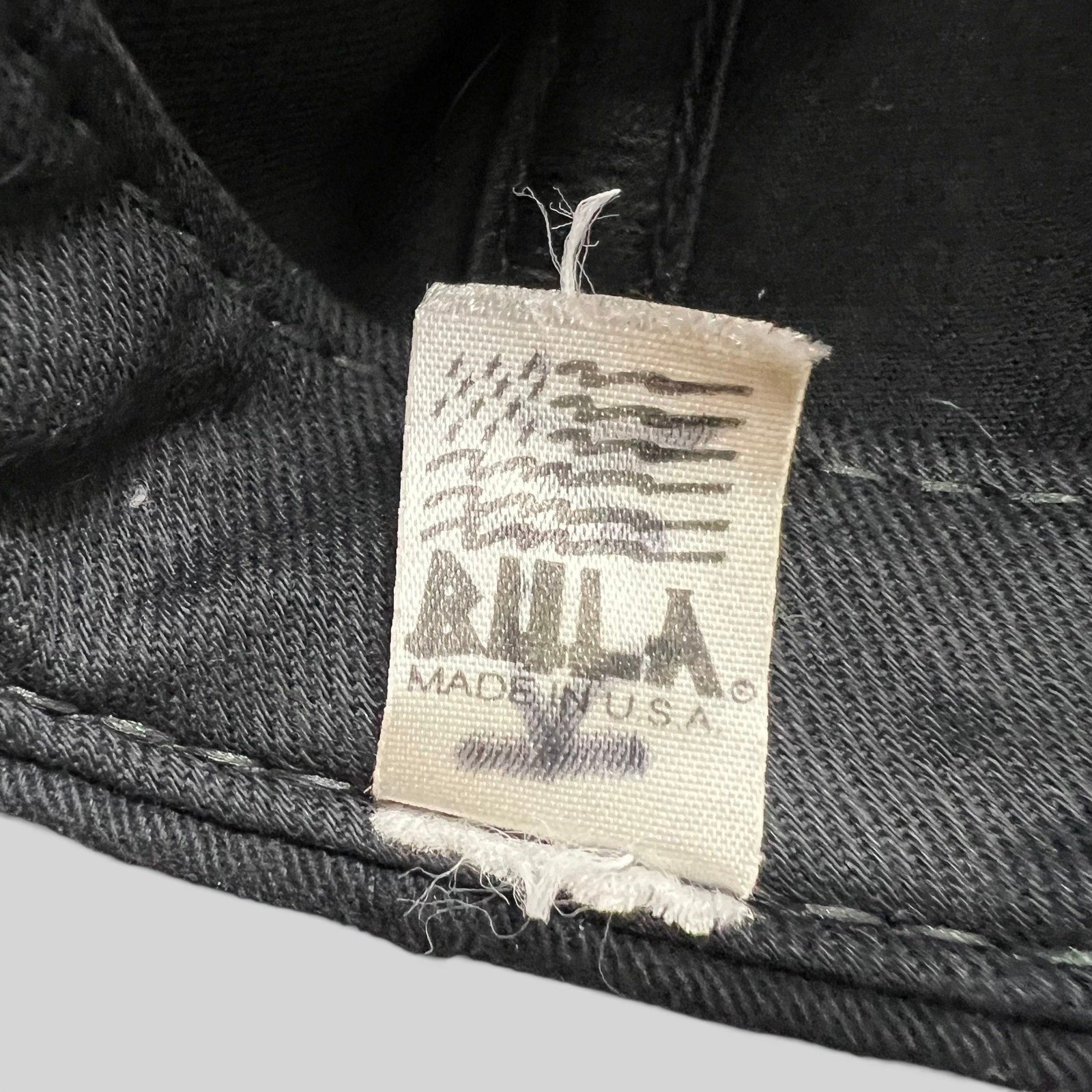 Raree Finds vintage BULA USA Ski Team hat interior fabric tag with Made in USA text on black cotton material