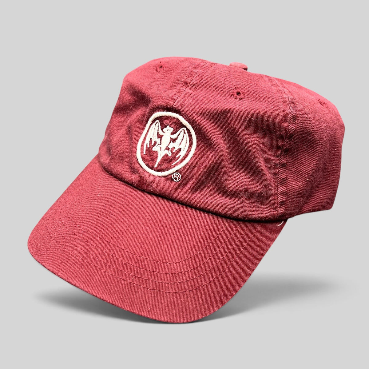 Raree Finds burgundy cotton strapback hat featuring an embroidered white Bacardi bat logo on the front crown.