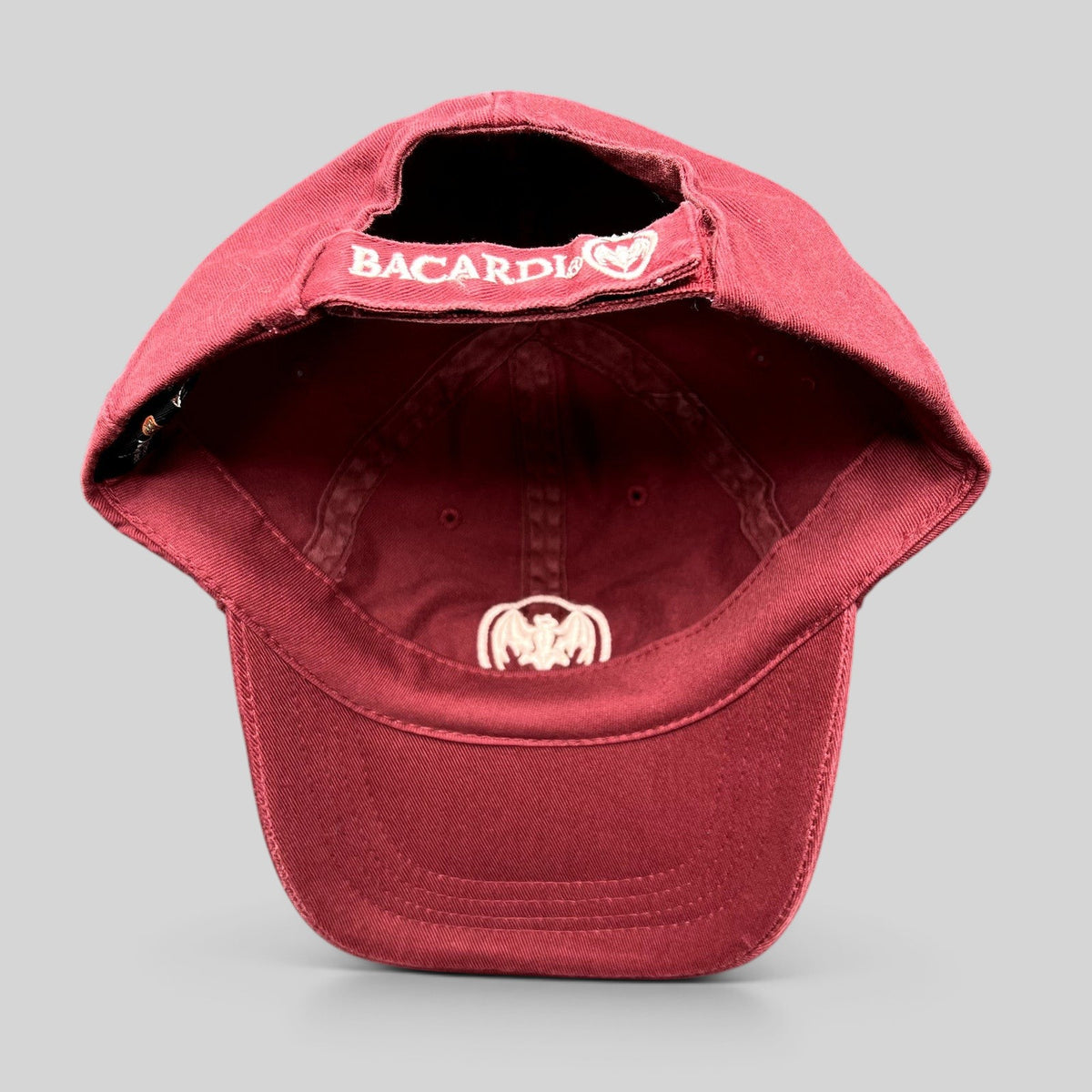 Raree Finds burgundy cotton strapback hat with embroidered Bacardi bat logo and rear strap branding