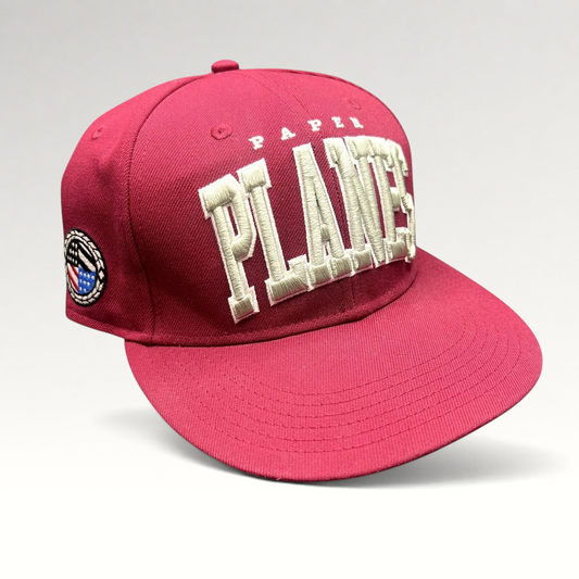 Raree Finds burgundy Paper Planes fitted hat with raised 3D white PLANES embroidery and side patch detail