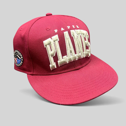 Raree Finds burgundy Paper Planes fitted hat with raised 3D PLANES embroidery and side patch detail