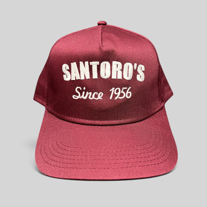 Raree Finds burgundy Otto Cap snapback hat with white Santoro’s Since 1956 embroidery and a structured flat brim.