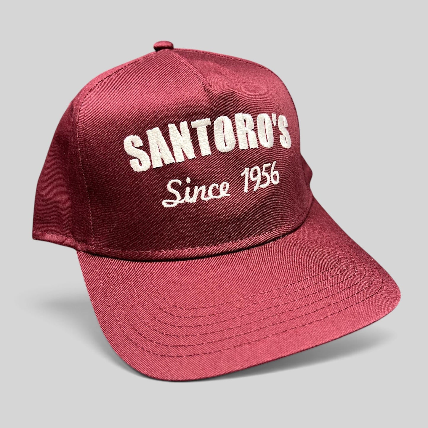 Raree Finds burgundy Otto Cap snapback hat with white embroidered Santoro’s Since 1956 logo and flat brim