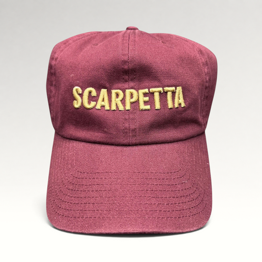 Raree Finds burgundy strapback hat with Scarpetta embroidered in gold lettering on the front crown