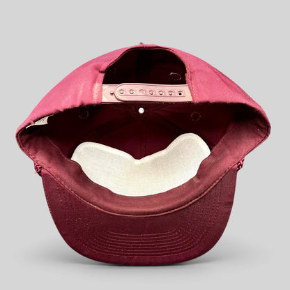 Raree Finds vintage burgundy snapback trucker hat interior view showing the adjustable snap closure and sweatband.