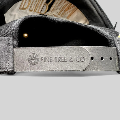 Raree Finds vintage Burton Snowboards snapback hat featuring a premium black leather snap closure by Fine Tree & Co.