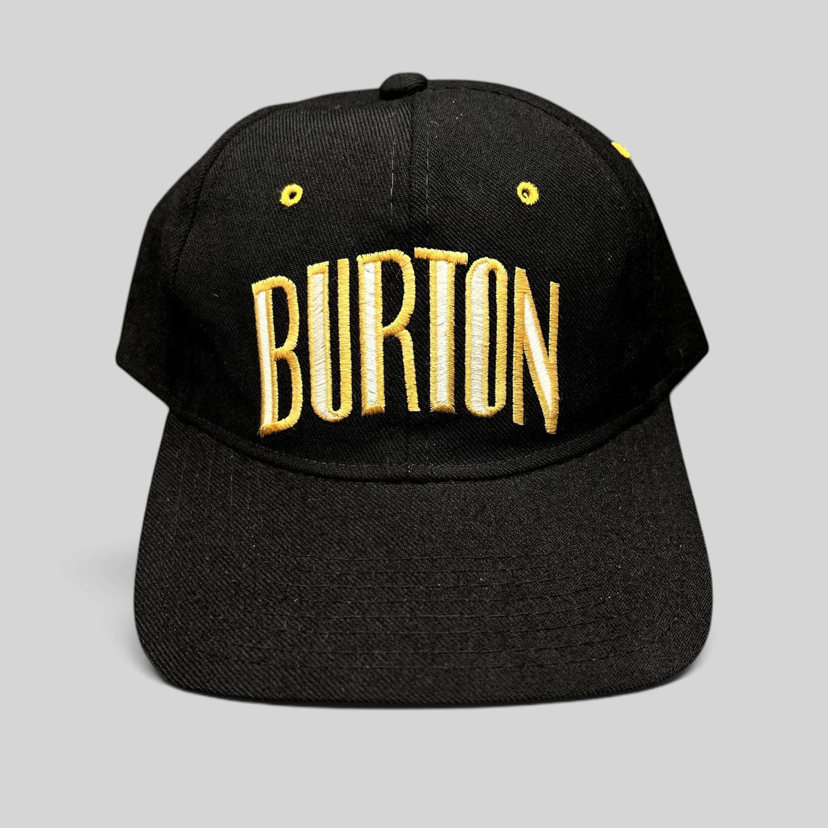 Raree Finds vintage Burton Snowboards snapback hat in black with gold and white embroidered lettering