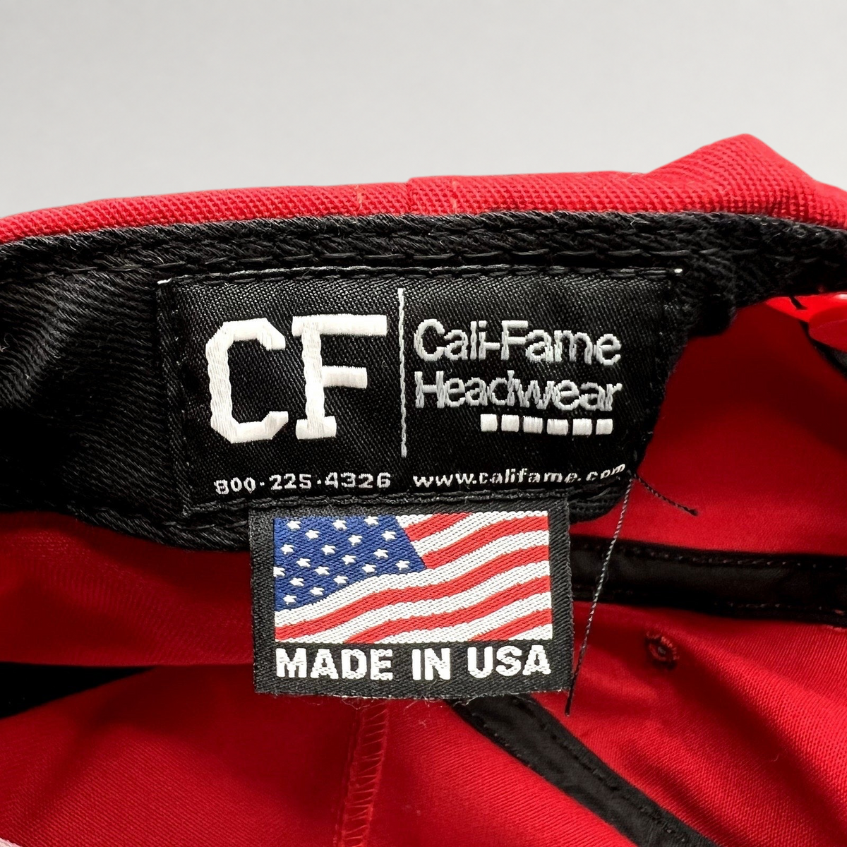 Raree Finds official Cali-Fame Headwear Made in USA tag inside a red MAGA snapback hat
