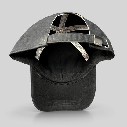 Raree Finds vintage black Calvin Klein strapback hat showing interior branded taping and metal buckle closure