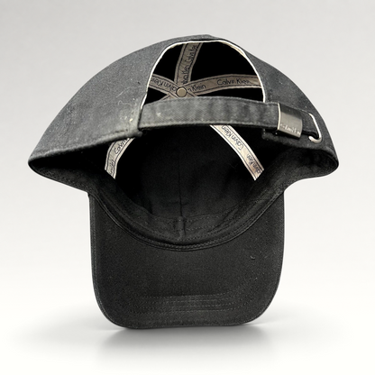 Raree Finds vintage black Calvin Klein strapback hat showing interior branded taping and metal buckle closure