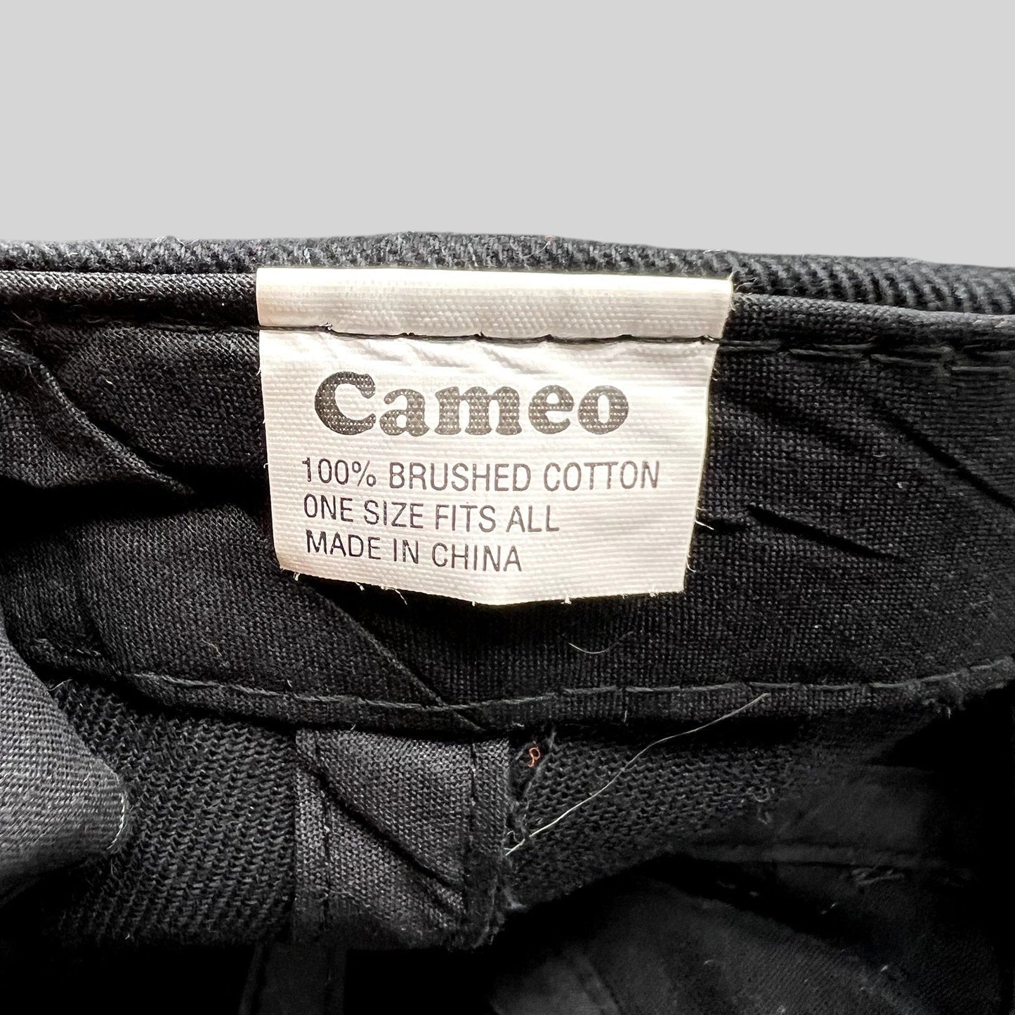 Raree Finds vintage Cameo cap interior label showing 100% brushed cotton material and one size fits all details
