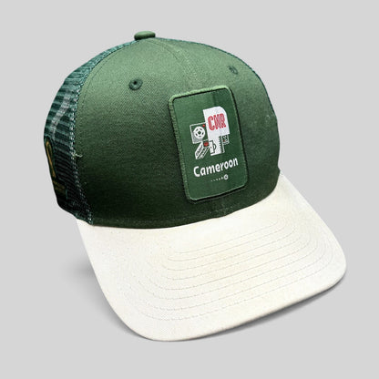 Raree Finds FIFA World Cup Qatar 2022 Cameroon CMR snapback trucker hat with green crown, white brim, and mesh back.