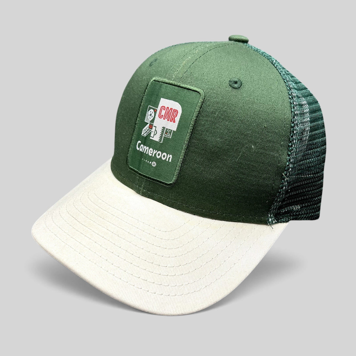 Raree Finds FIFA World Cup Qatar 2022 Cameroon CMR snapback trucker hat with green crown, white brim, and mesh back.